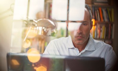 Middle aged man using computer